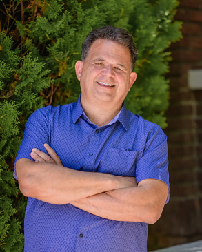 Doug Pitassi in a blue shirt with great pose